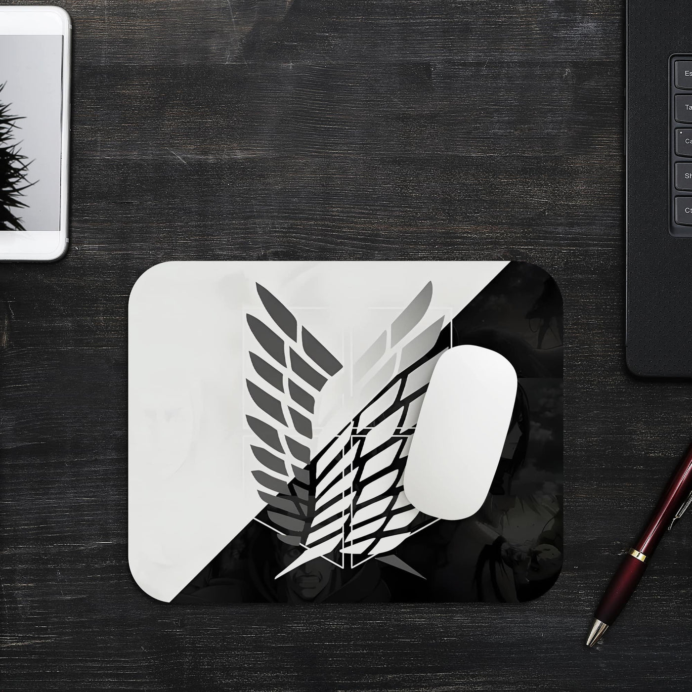 This mouse pad features the iconic Survey Corps emblem from Attack on Titan, split into a sleek black-and-white design. The bold, minimalist style adds a professional yet fandom-inspired look to your desk, while the smooth surface ensures optimal mouse control and the non-slip base provides stability.