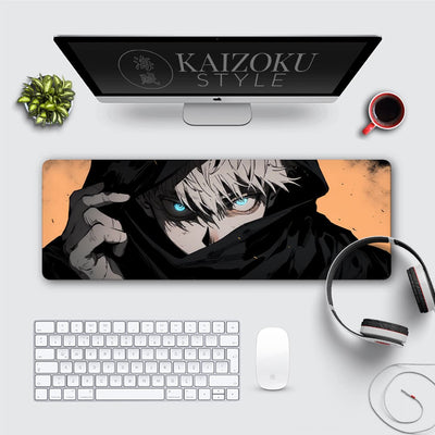 A desk mat featuring Gojo Satoru from Jujutsu Kaisen in a dramatic close-up. His piercing blue Six Eyes glow intensely, framed by a black hood, set against a contrasting orange background. This bold design adds a striking and powerful anime theme to the workspace.