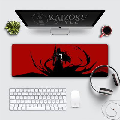 A desk mat featuring Ichigo Kurosaki from Bleach. The image depicts him amidst his powerful Getsuga Tensho aura, creating a dynamic and visually striking scene. It's a must-have for any fan of the series.