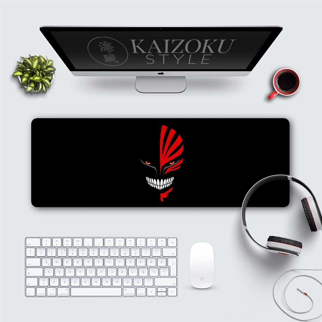 A desk mat featuring Ichigo Kurosaki's menacing Hollow Mask from the Bleach anime. The design is striking and captures the character's inner darkness. It's a must-have for any fan of the series.